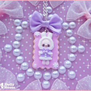Kawaii Winter Cookie Necklace with a pastel pink cookie pendant, tiny winter character and purple satin bow — additional view 1