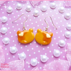 Bear Pancake Earrings with golden bear-shaped pancakes, honey glaze and white butter details on a purple polka-dot background — additional view 1
